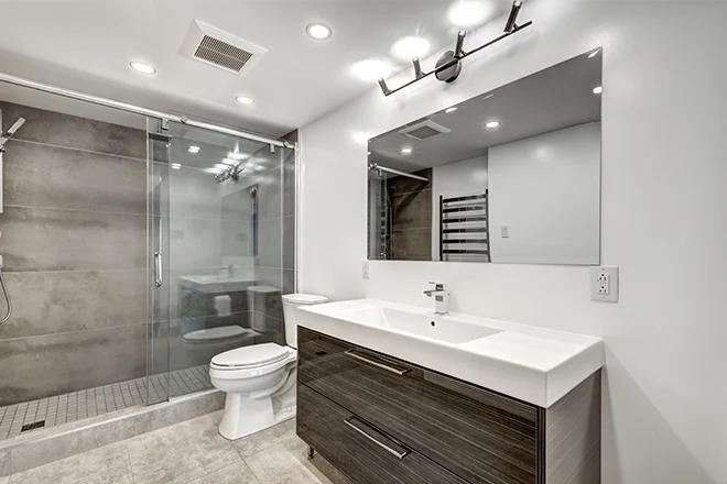New bathroom with single hardwood vanity and glass walk in shower