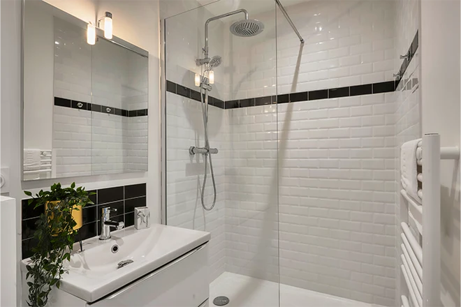 Bathroom shower with white tile