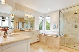 Beige bathroom tile in a primary bathroom