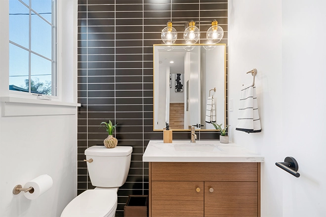 Small bathroom with black accent wall