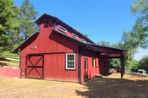 Red country barn construction after completion